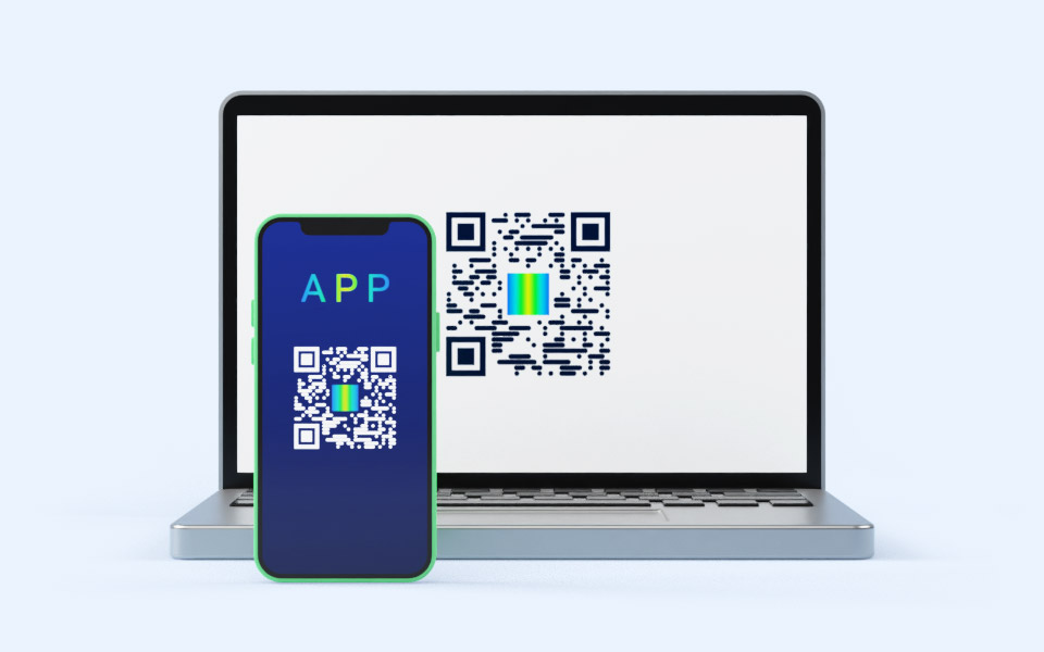 Laptop with WWPass QR-code and smartphone